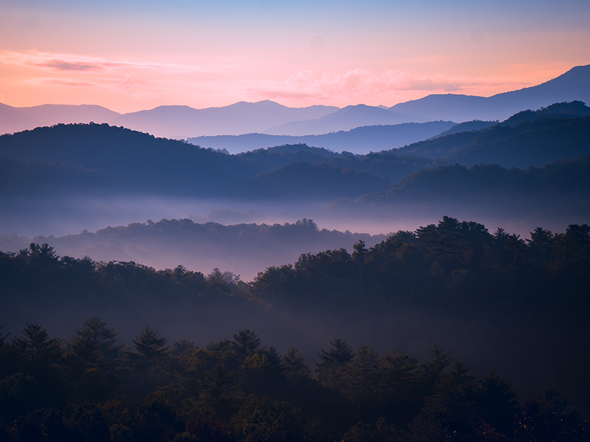 A scenic rolling hills landscape at dusk